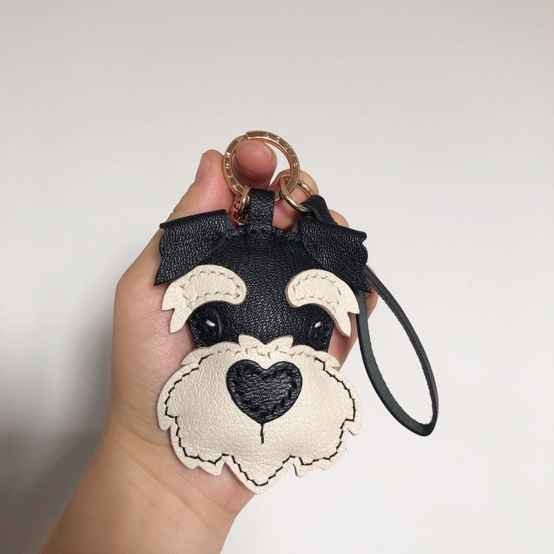 Maßgefertigte Hundetaschen, Schlüsselanhänger, Autoschlüsselanhänger und Halsketten mit Schnauzer-Motiv aus importiertem französischem Schaffell, handgenäht, Lieferzeit 15 Tage. Schnauzer-Lanyards sind ebenfalls als Geschenk erhältlich.