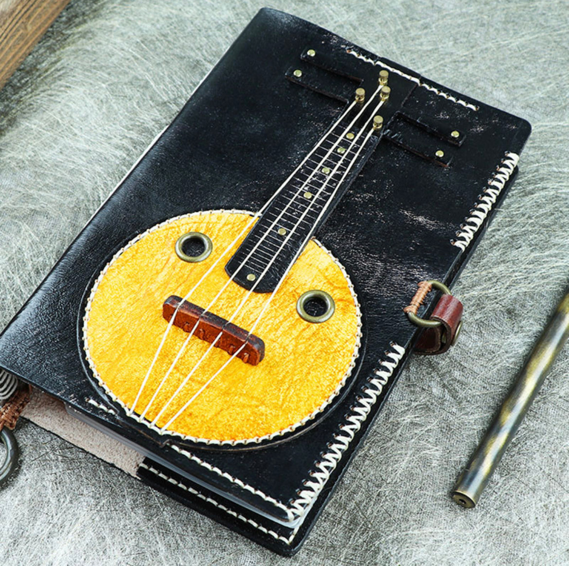 Customized delivery in 15 days Zhong Ruan cowhide handbook genuine leather handmade folk music notepad loose-leaf a6 musical instrument original diary retro notebook Zhong Ruan loose-leaf notebook a6